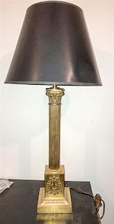 A Neoclassical Brass Table Lamp Height overall 34 inches.