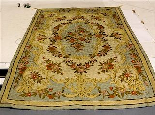 * An Aubusson Style Hooked Tapestry 8 feet 9 inches x 5 feet 8 inches.