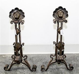 A Pair of Continental Cast Metal Andirons Height 20 inches.