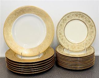 A Collection of Gilt Rimmed Porcelain Plates Diameter of largest 10 3/4 inches.