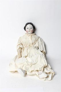 A Victorian Porcelain Headed Doll, attributed to Kister Length 25 inches.