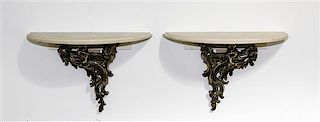 A Pair of Louis XV Style Gilt Metal and Limestone Chenets Height overall 15 1/2 x width 24 inches.
