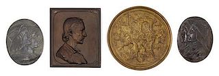 * A Group of Four Continental Bronze Plaques Diameter of largest 7 1/4 inches.