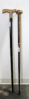 * A Group of Two Canes Length of longest 36 5/8 inches.
