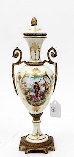 * A French Gilt Metal Mounted Porcelain Urn Height 14 1/4 inches.
