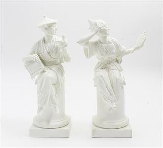 * A Pair of Royal Worcester Bisque Porcelain Figures Height 11 1/2 inches.