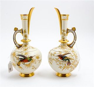 * A Pair of Royal Worcester Porcelain Ewers Height 10 1/4 inches.