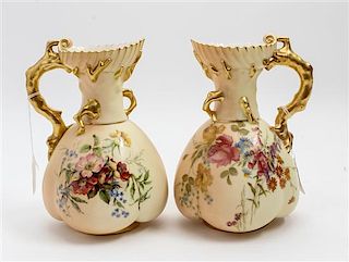 * A Pair of Royal Worcester Porcelain Ewers Height 8 1/2 inches.