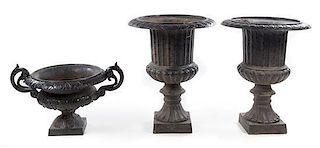 * Three Victorian Style Cast Iron Urns Height of tallest 39 inches.