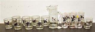 A Set of Game Decorated Glasses Height of pitcher 9 1/8 inches.