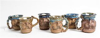 * A Group of Six Anthropomorphic Ceramic Mugs Height of tallest 5 1/4 inches.
