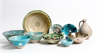* A Group of Nine Middle Eastern Ceramic Bowls Diameter of largest 11 inches.