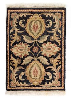 * An Indian Wool Rug 2 feet 4 inches x 1 foot 8 inches.