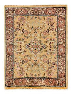 * An Indo-Kirman Wool Rug 1 foot 10 inches x 1 foot 5 3/4 inches.