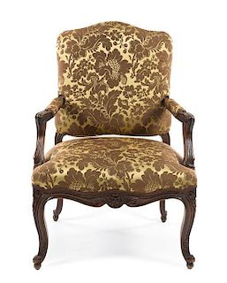 A Louis XV Fauteuil Height 38 inches.