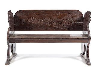* A Northern European Carved Wood Bench Height 34 x width 52 1/2 x depth 23 inches.