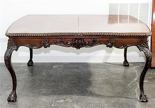 * A Chippendale Style Mahogany Dining Table Height 30 1/2 x width 64 x depth 49 1/2 (without leaves).