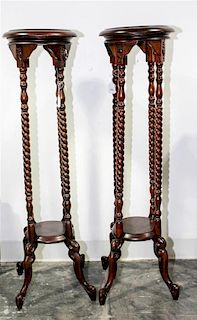 A Pair of Mahogany Pedestals Height 39 1/2 inches.
