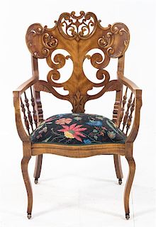 * A Victorian Walnut Needlepoint Armchair Height 36 5/8 inches.