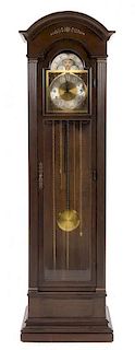 * An American Mahogany Tall Case Clock, Trend Height 74 1/2 x width 21 1/2 x depth 12 1/2 inches.