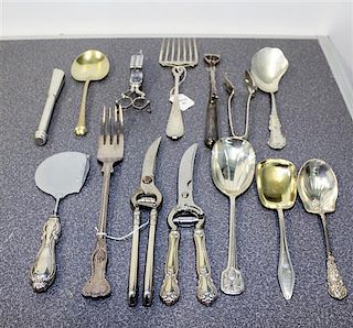 A Collection of Silver and Silver-Plate Serving and Table Articles Length of longest 12 3/4 inches.