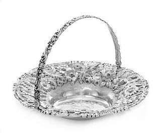 * An American Silver Bread Basket, Jenkins & Jenkins Inc., Baltimore, MD, the volute and foliate decorated swivel handle surm