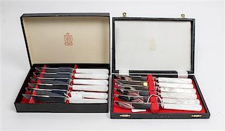 * A Set of Twelve English Steak Knives, Kirk & Matz, Sheffield, having steel blades and simulated mother-of-pearl handles.