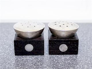 A Pair of Mexican Silver and Rosewood Castors, William Spratling, Taxco, the square ebony base with inset silver discs with a