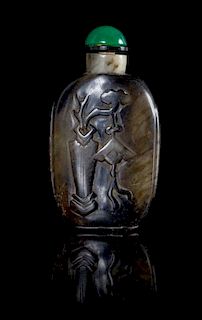 * A Black and White Jade Snuff Bottle Height 3 inches.