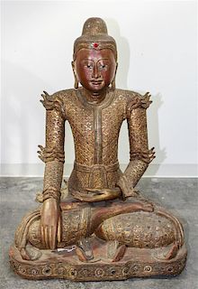 * A Burmese Giltwood Seated Figure of Buddha Height 40 inches.