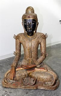 * A Burmese Giltwood Seated Figure of Buddha Height 47 inches.