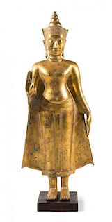 A Thai Gilt Bronze Figure of Standing Buddha