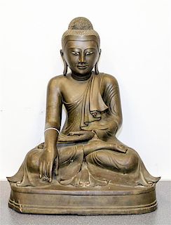 A Burmese Bronze Figure of Seated Buddha Height 18 1/2 inches.