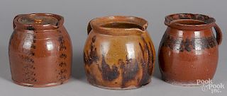 Three redware pitchers, 19th c.