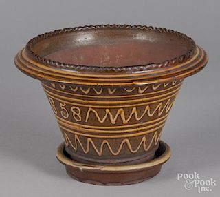 English redware flower pot, dated 1858.