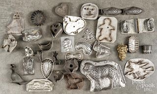 Collection of tin cookie cutters and molds