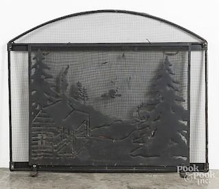Wire firescreen, with cutout landscape with cabin