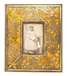 A Tiffany Studios Dore Bronze and Favrile Glass Picture Frame, Height 7 3/4 x width 6 1/2 inches.