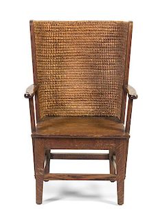 An English Oak and Rush Stronza Open Armchair, Liberty & Co., Height 33 3/4 inches.