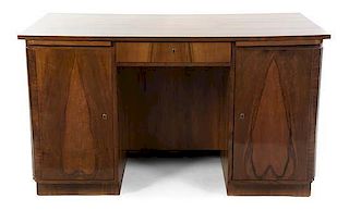 An Art Deco Rosewood Desk, Height 31 3/4 x width 55 1/4 x depth 31 inches.