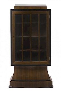 An Art Deco Walnut and Ebonized Vitrine Cabinet, Height 70 x width 51 1/2 x depth 21 inches.