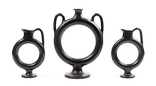 A Group of Three Italian Black-Fired Ewers Height of tallest 12 1/2 inches.