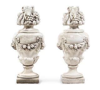 A Pair of Cast Stone Models of Fruit-Filled Urns Height 31 inches.