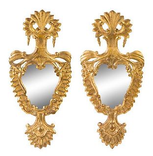 A Pair of Italian Baroque Giltwood Mirrors Height 30 1/8 x width 14 inches.