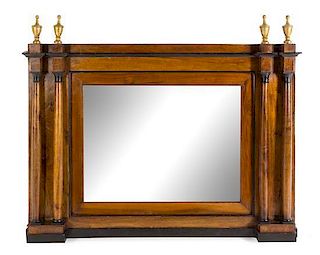 An Italian Parcel Ebonized Walnut Mirror Height 34 1/2 x width 48 inches.