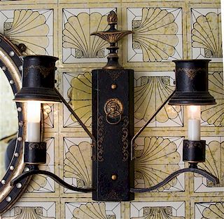 A Pair of Regency Style Black and Gilt Tole Two-Light Sconces Height 20 inches.