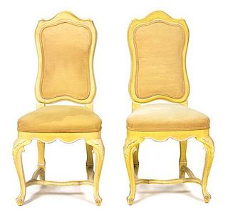 A Set of Sixteen Rococo Style Yellow and White Painted Wood Dining Chairs Height 40 1/2 inches.