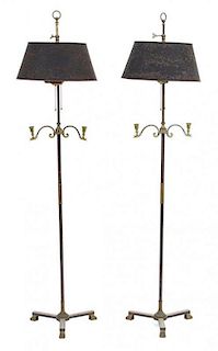 A Pair of Black and Gilt Metal Floor Lamps Height 60 inches.
