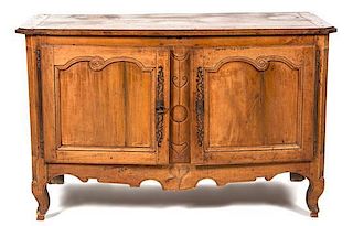 A Louis XV Provincial Carved Fruitwood Cabinet Height 34 x width 55 x depth 24 inches.