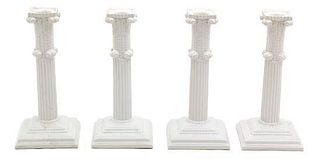 A Group of Four Column-Form Porcelain Candlesticks Height 8 3/4 inches.